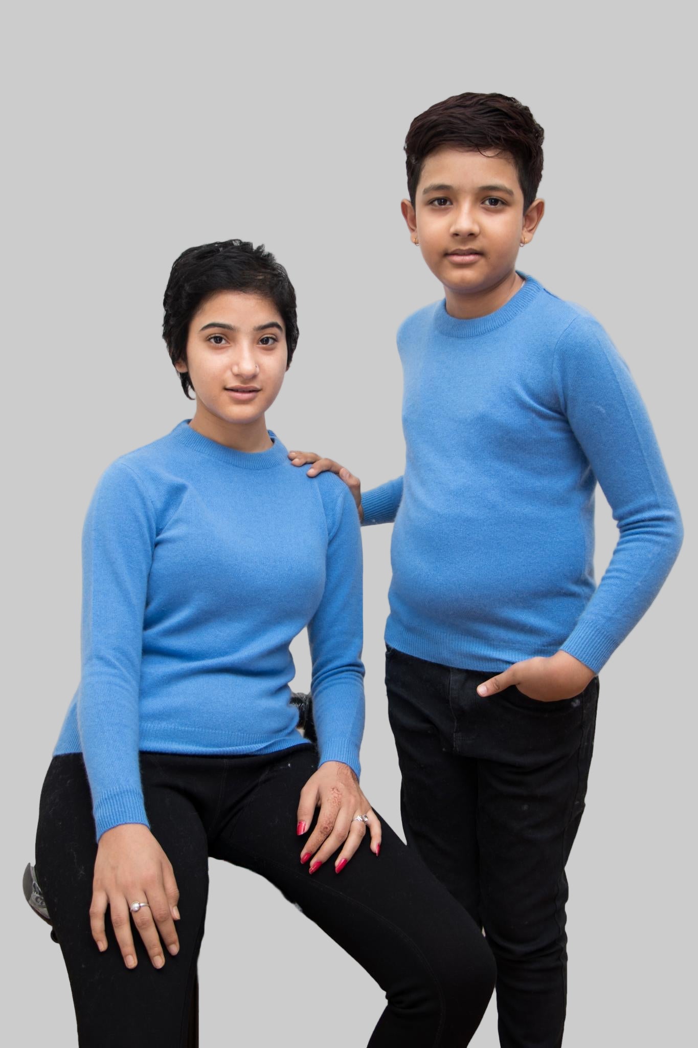 “Girl wearing blue 100% cashmere sweater handmade in Nepal”